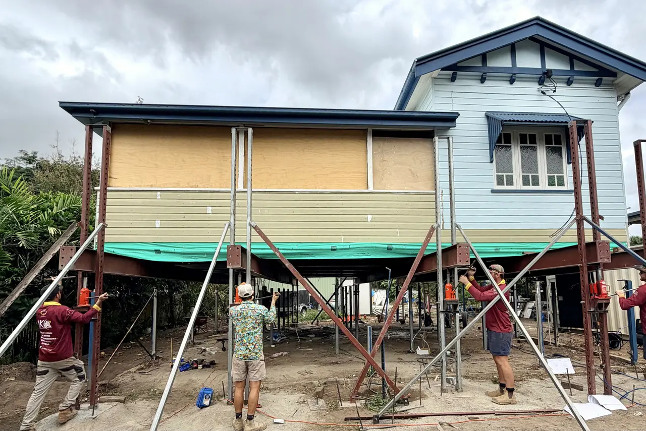 JKC crew working the hydraulic jacks during a house raise