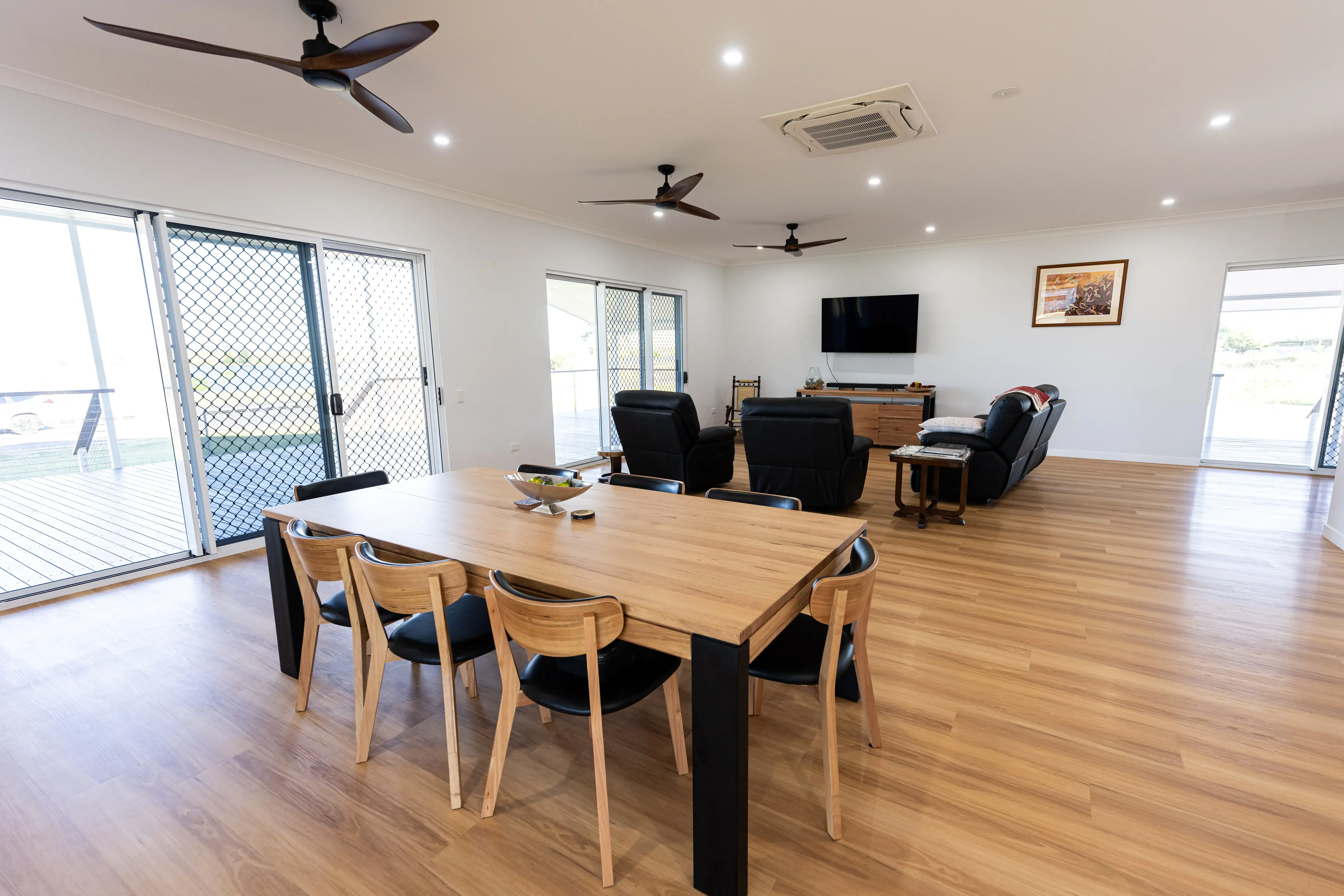 Dining and living areas with sliding doors out to the verandah