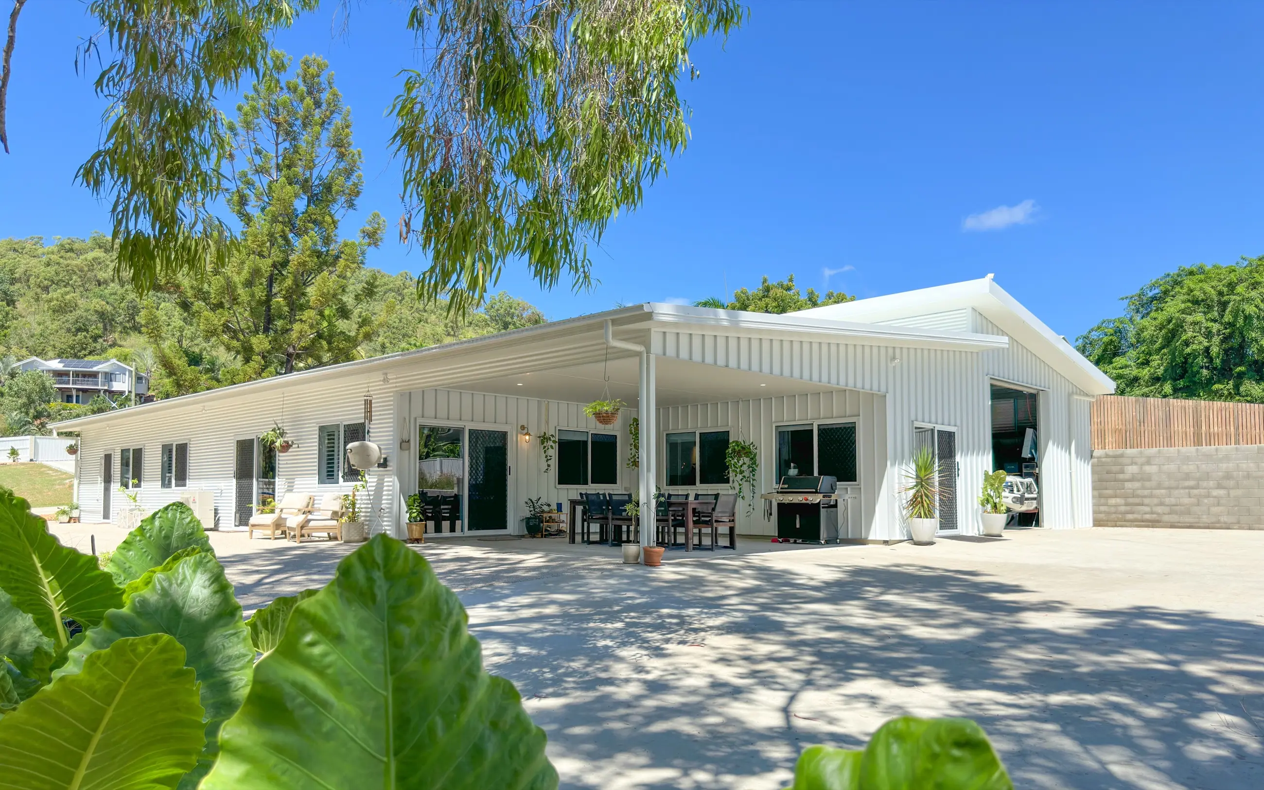 Completed Robinson Street custom home with white cladding and a deep covered outdoor room