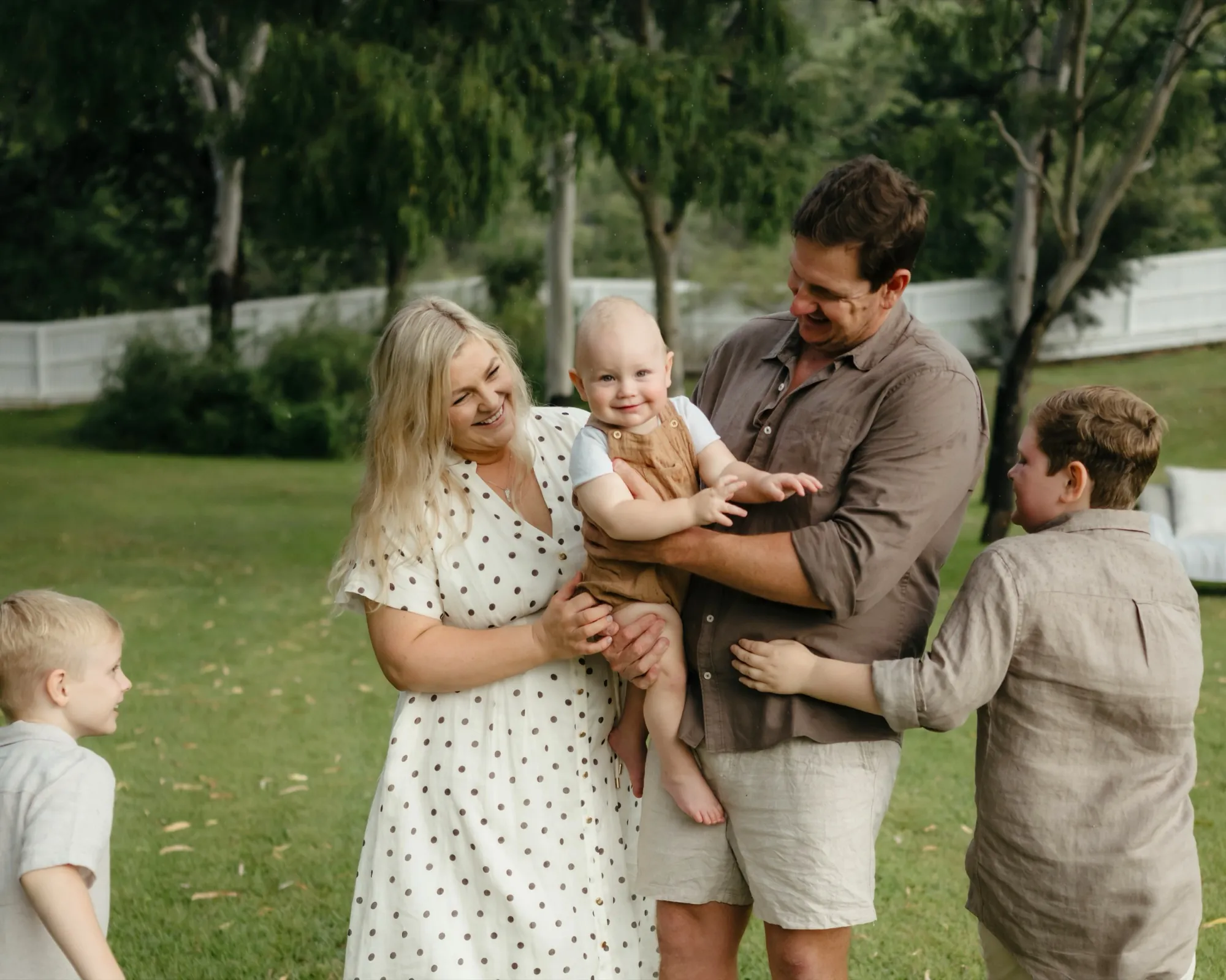 Patrick and Reiannan Kenna with their three sons in the garden